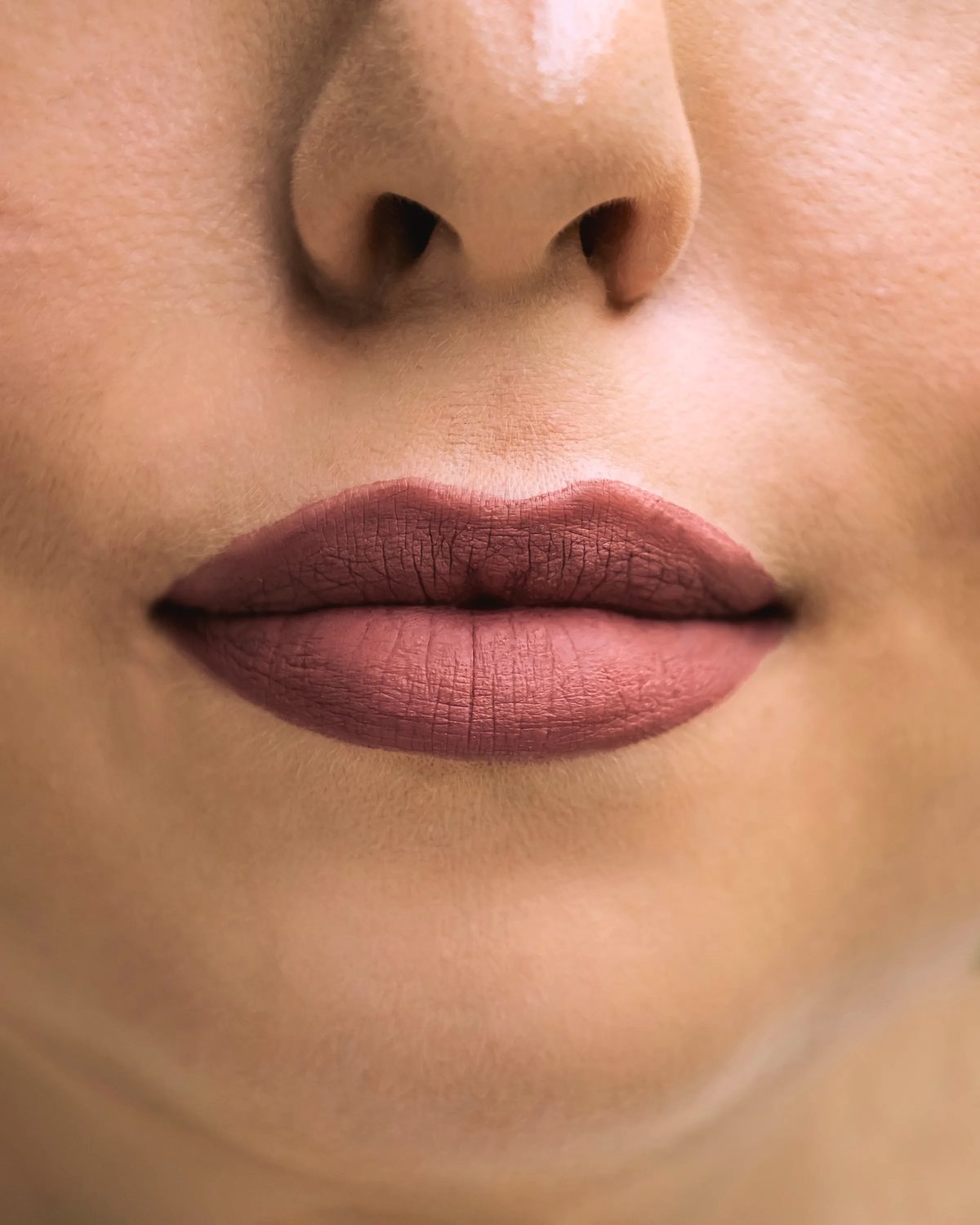 Close-up of a model’s softly defined, natural-looking lips