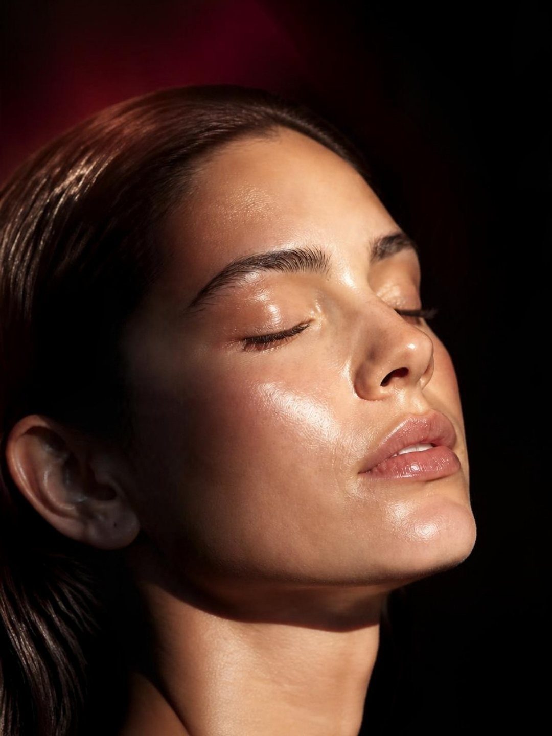 Model with glowing skin in warm golden light
